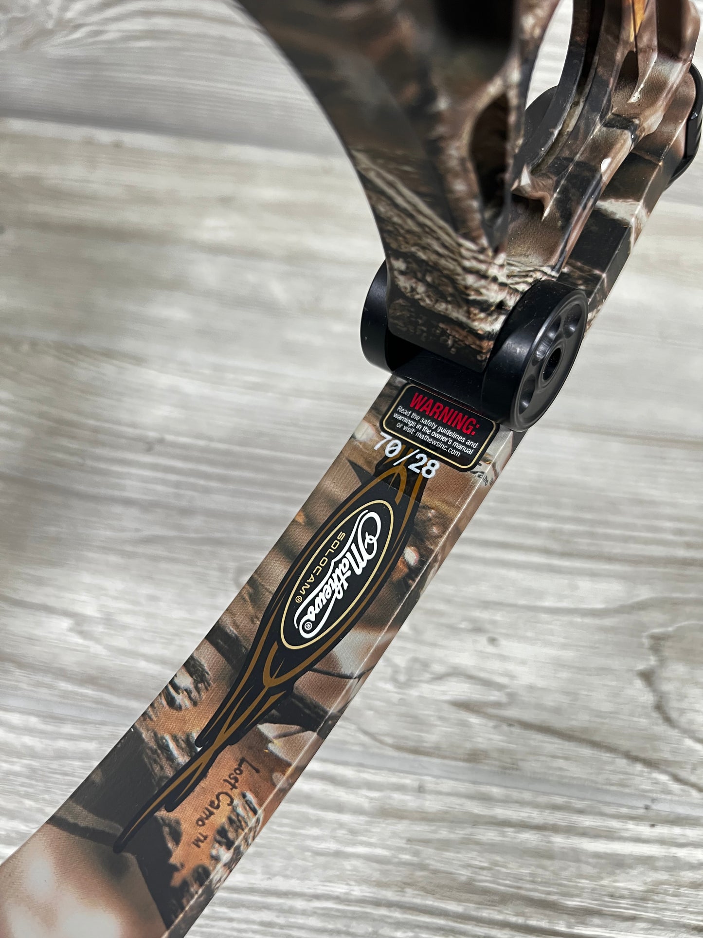 Used Mathews Heli-m rh lost camo 70# 28" with quiver