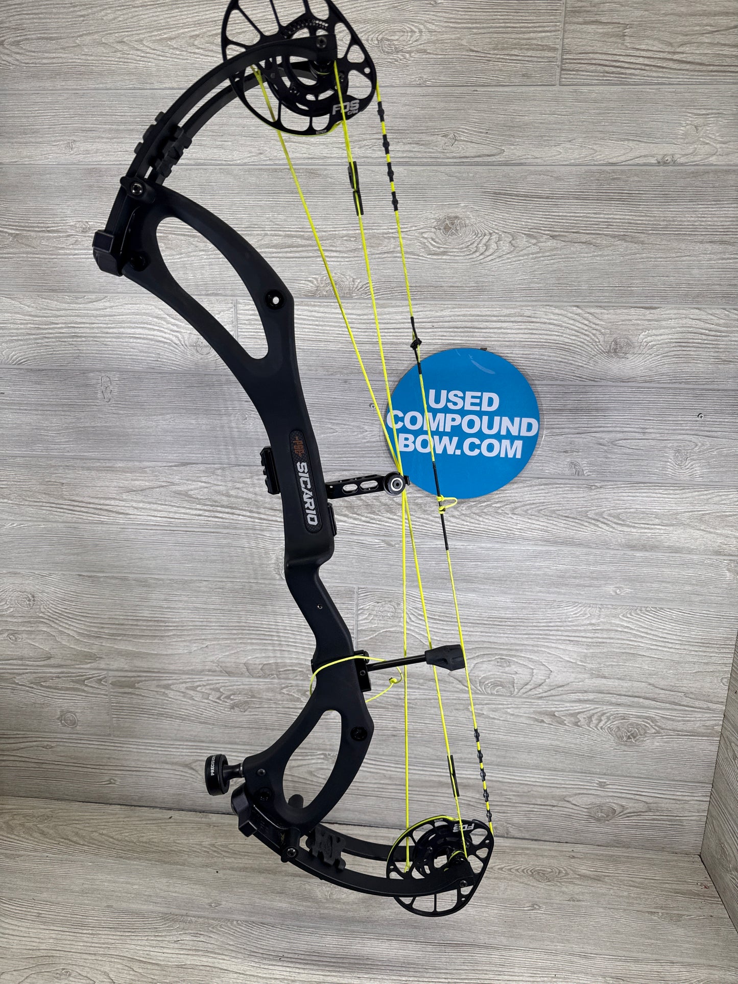 Used PSE Sicario FDS Black Right Handed with custom strings 70#